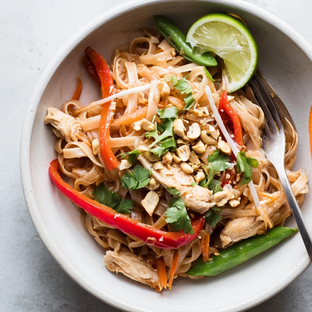 Imagine slurping flavorful noodles in these delicious, easy Thai Chili Chicken Noodle Bowls recipe.