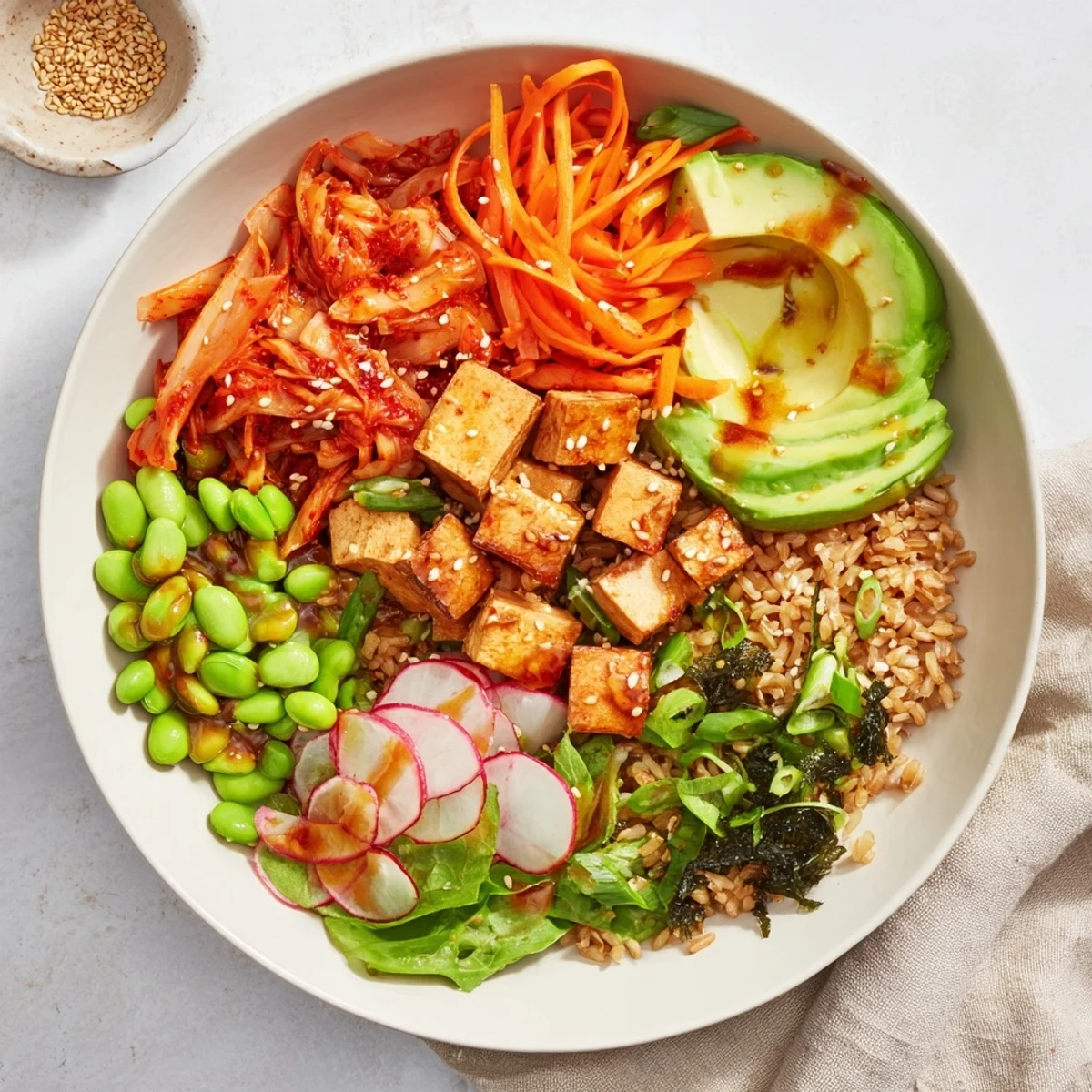 Healthy fermented vegetable bowl drizzled with dressing, showcasing colorful seasonal ingredients.
