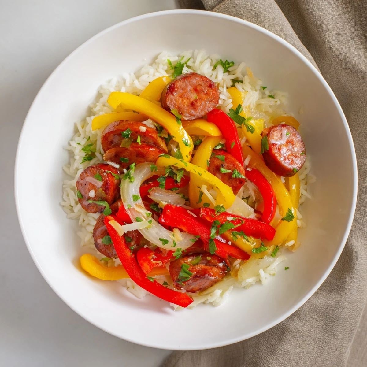 Vibrant photo of a cooked Italian Sausage & Peppers Rice Plate with colorful bell peppers and rich flavors.