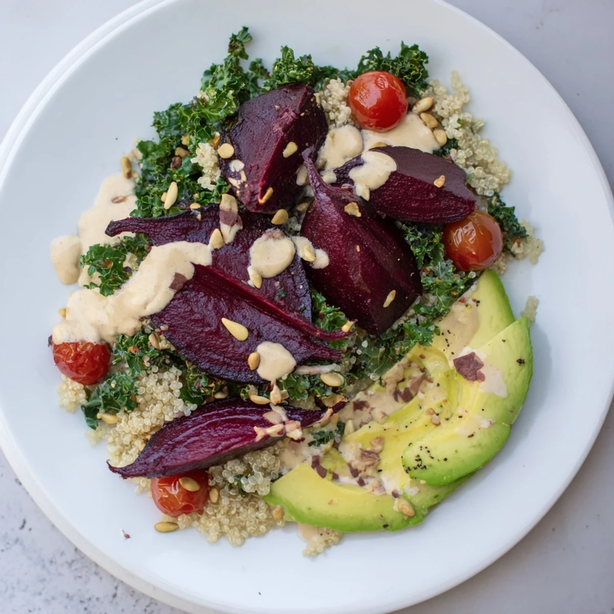 A colorful image of the Quinoa, Kale & Roasted Beet Bowl, showcasing the vibrant ingredients and textures.