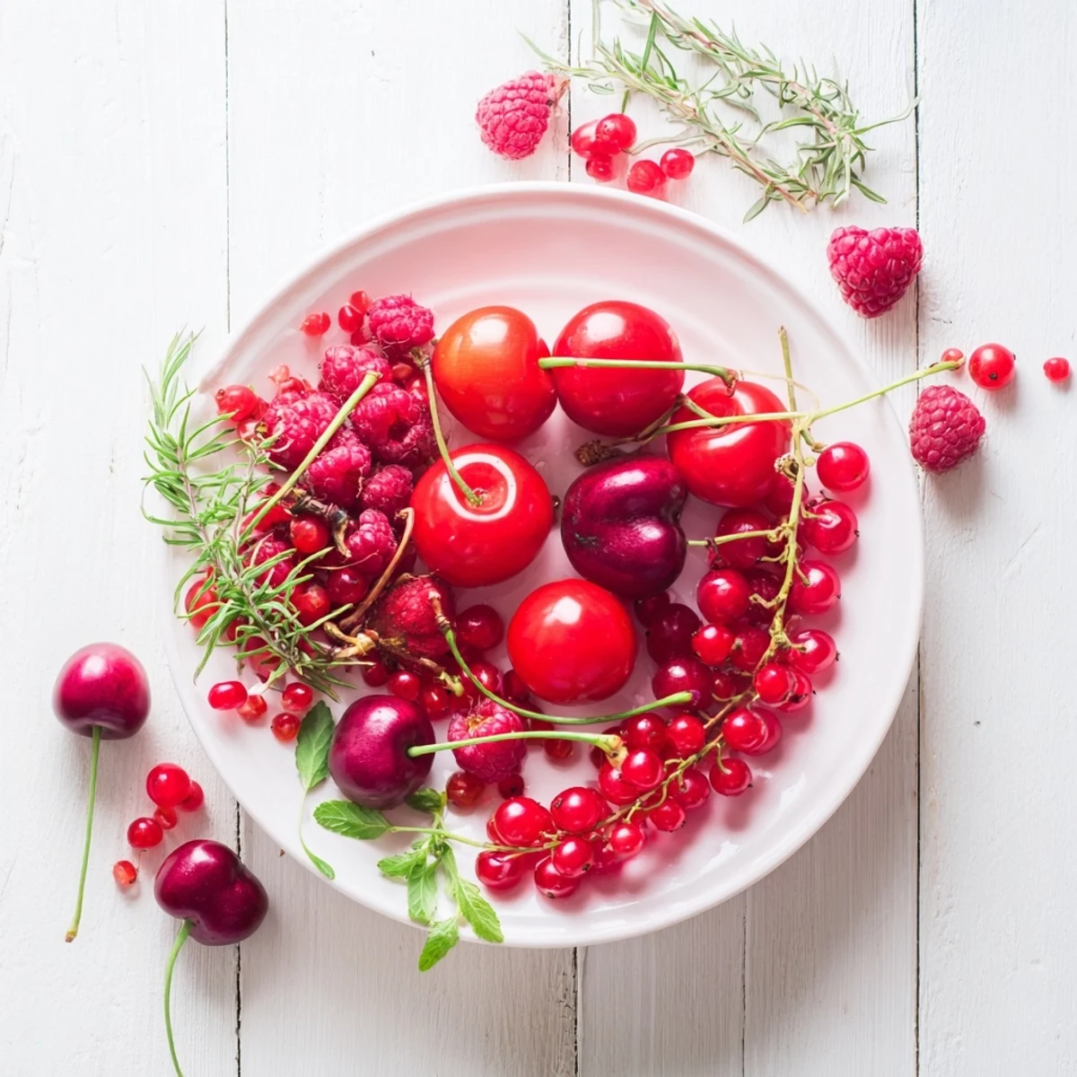 The Holly Berry Cluster appetizer, a beautiful arrangement of colorful berries and herbs.
