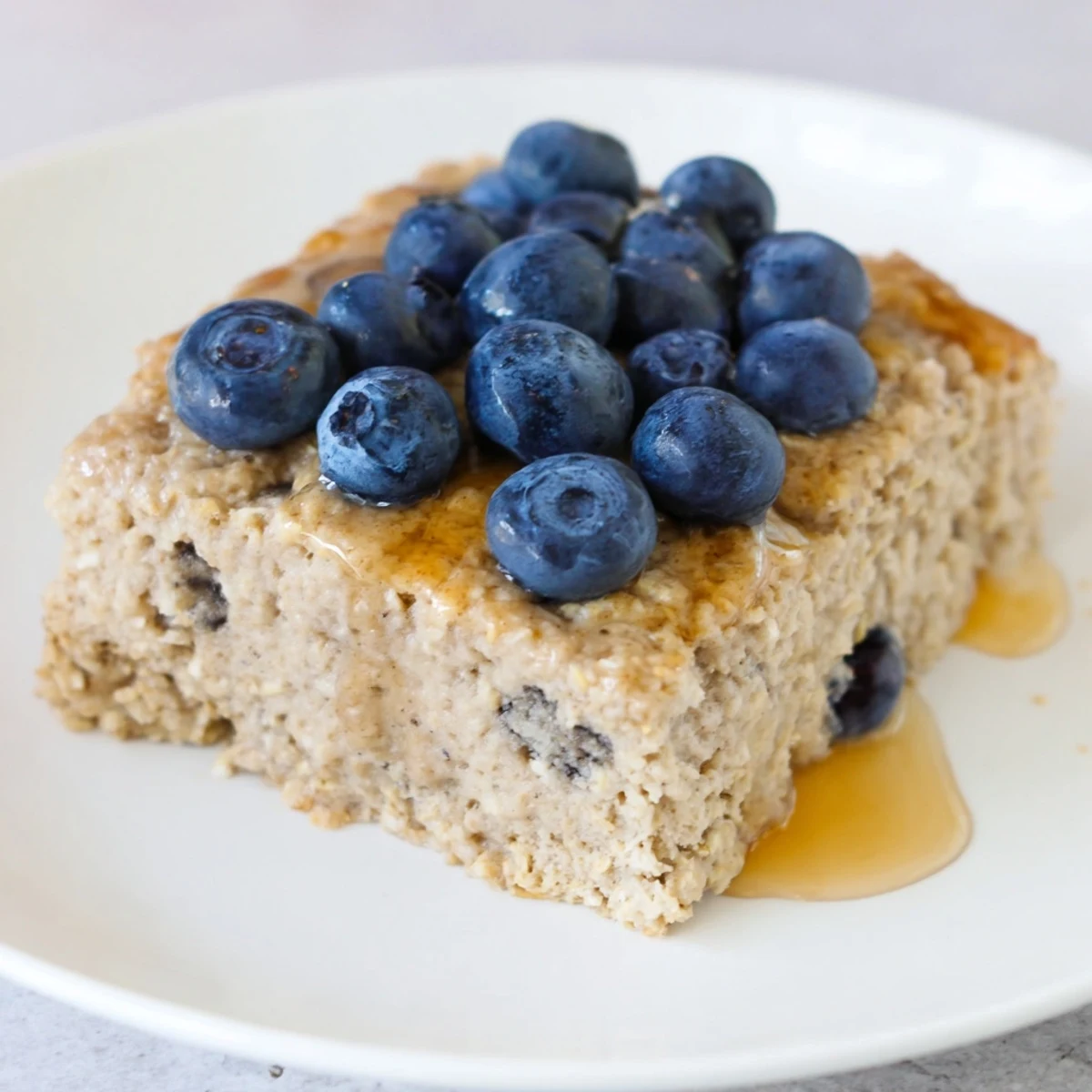 Thick and fluffy Protein Pancake Oats, baked to golden perfection and served with fresh berries.