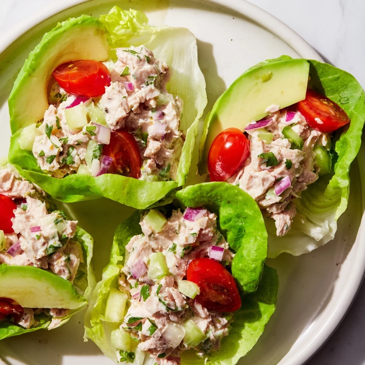 Fresh tuna salad lettuce wraps, filled with creamy tuna and veggies, ready to enjoy.