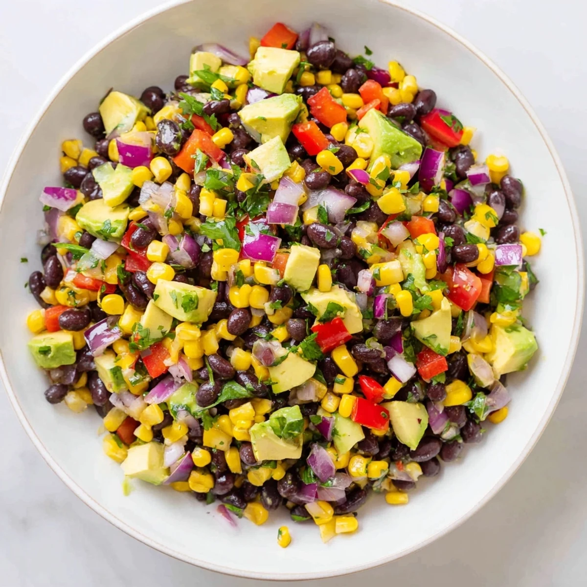 Vibrant Southwest Black Bean Salad, a colorful medley of textures, tossed in a bright lime dressing.