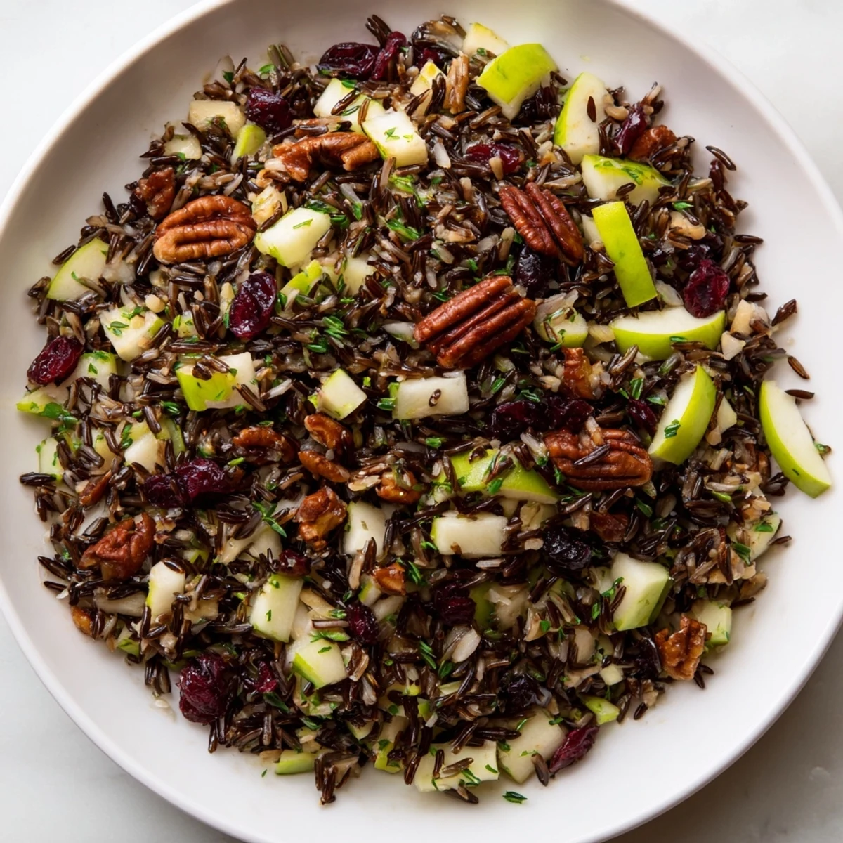 Close-up of Wild Rice Harvest Salad; the nutty rice and vibrant colors look incredibly fresh.