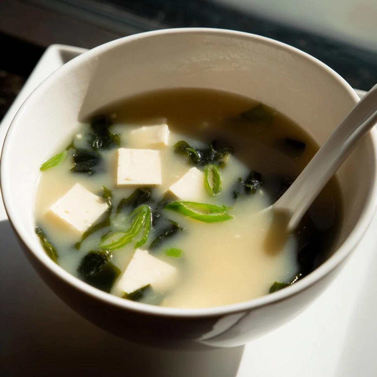 Silky cubes of tofu and tender wakame swim in a warm, savory broth of this classic miso soup.  