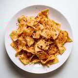 Baked pasta chips tossed in flavorful seasonings, ideal with your favorite dip.  