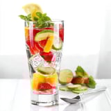 Colorful mocktail blend featuring ice, fruit, and flavor enhancers for summer.  