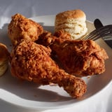 Juicy fried chicken garnished with homemade buttermilk biscuits, a Southern food classic.  