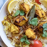 Aromatic Easy Chicken Biryani with visible herbs and golden onions, promising comforting Indian flavors in every bite.
