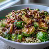 Roasted Brussels Sprouts Bowl garnished with toasted walnuts, dried cranberries, and pumpkin seeds for a wholesome, fiber-rich lunch.