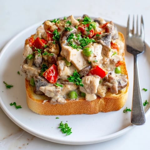 Creamy Chicken à la King over crispy toast, perfect for cozy weeknight dinners.  