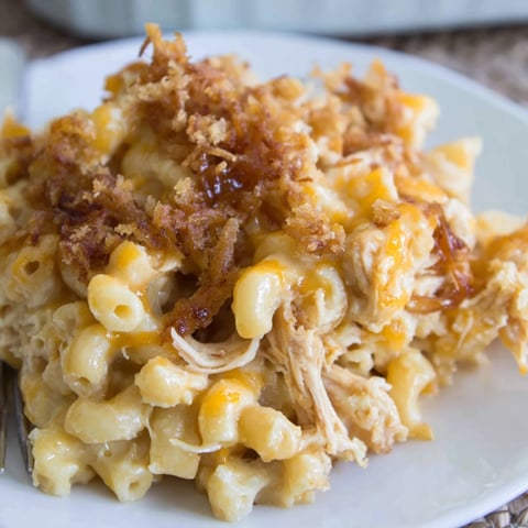 Creamy classic mac & cheese with smoky BBQ chicken, baked to golden perfection.  