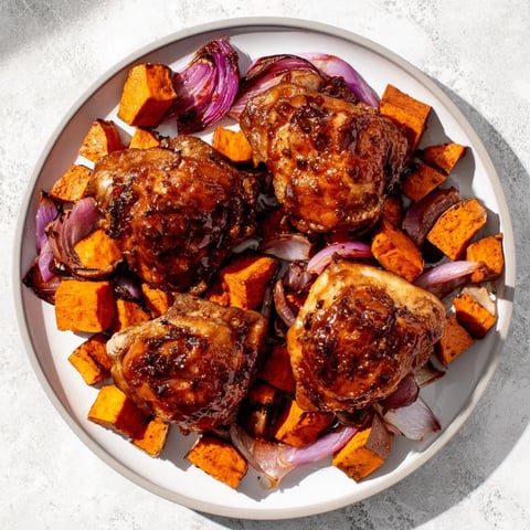 Golden brown Maple Glazed Chicken & Sweet Potato Bake with tender vegetables, ready to serve.