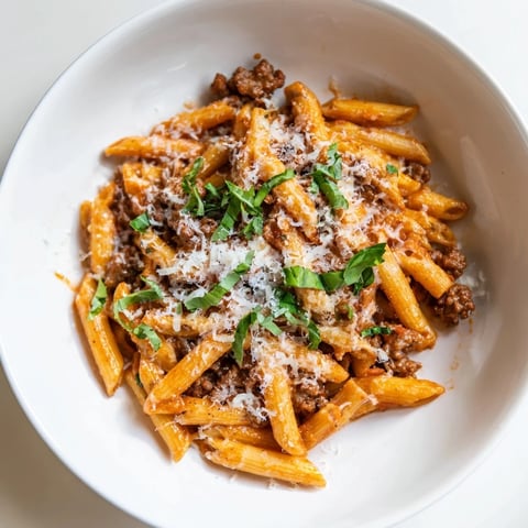 Sizzling Italian sausage and creamy tomato sauce hug al dente penne in this Creamy Tomato and Sausage Pasta.