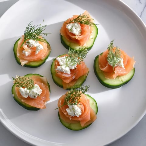 Champagne pairings: a beautiful platter with smoked salmon, prosciutto, and ripe grapes served.
