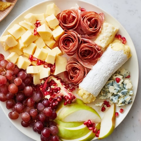 A beautiful Winter Wonderland Grazing Tray, overflowing with cheeses, fruits, and meats for sharing.