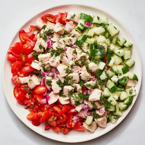Fresh Cucumber and Chicken Clean Shaker salad with vibrant colors and tender chicken pieces.