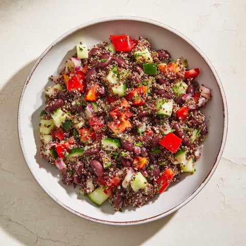 Vibrant Dense Bean Salad, a colorful mix of beans and seeds ready to serve.