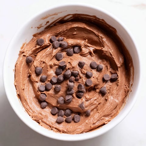 Gluten-free brownie batter dip, a decadent dessert spread, ready for dipping fruits and cookies.