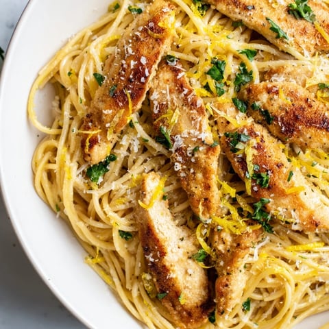 Golden-brown seared chicken strips and al dente spaghetti tossed in a glossy brown butter sauce with fresh lemon and parsley.