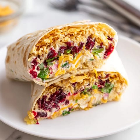 Enjoy the spicy-sweet flavors of Cranberry Jalapeño Dip Crunch Wraps at gatherings!  