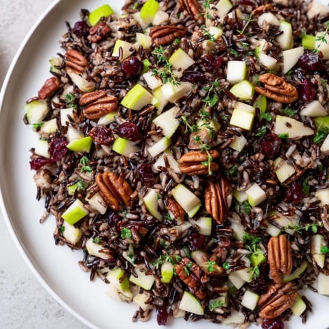 Hearty Wild Rice Harvest Salad with a zesty vinaigrette, perfect for a light vegetarian lunch.