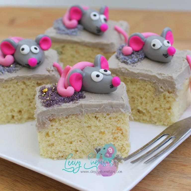 Festive Rat Cake Birthday Sheet Bake delightfully garnished with candy eyes and ears.
