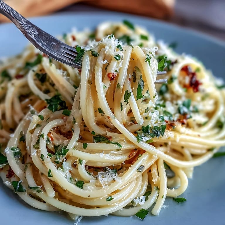 Zesty lemon pasta in a silky butter sauce, finished with parmesan and fresh basil for a vibrant springtime meal.
